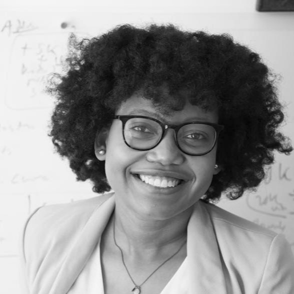 black and white photo of a smiling black woman
